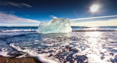 Thumbnail about Iceberg coming to shore at Glacier Lagoon