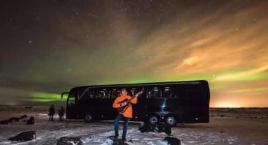 Thumbnail about Guide entertaining aurora lovers during Northern Light tour