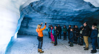 Thumbnail about Woman talking to Group in Ice Cave