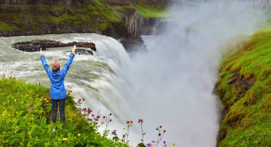 Thumbnail about Gullfoss in Iceland with happy woman in front