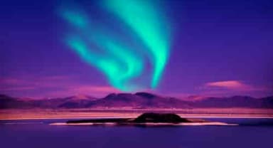 Thumbnail about Northern Lights over Mountain overlooking lake in Iceland