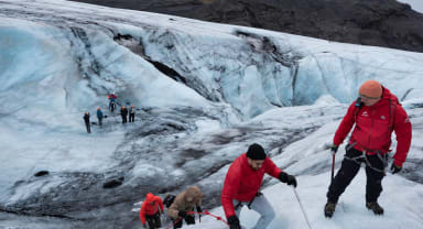 Thumbnail about Group of people hiking and climbing on a glacier