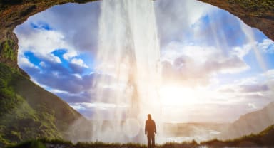 Thumbnail about Man standing behind Seljalandsfoss on Soath Coast of Iceland