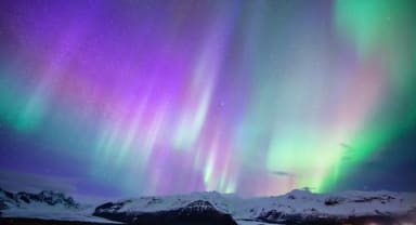 Thumbnail about Northern Lights over Mountain in Iceland