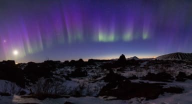 Thumbnail about Northern Lights over cliff in Iceland