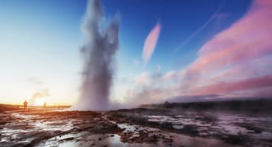 Thumbnail about Geyser erupting in the sunset