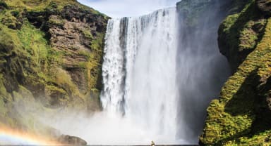 Thumbnail about Skogarfoss Waterfall in Summer with Green plants around