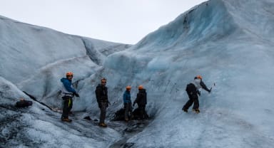 Thumbnail about People hiking and climbing on a glacier