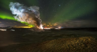 Thumbnail about Northern Lights behind a column of steam coming from one of Iceland's largest geothermal areas.