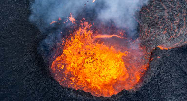 Thumbnail about Volcanic crater bubbling with lava