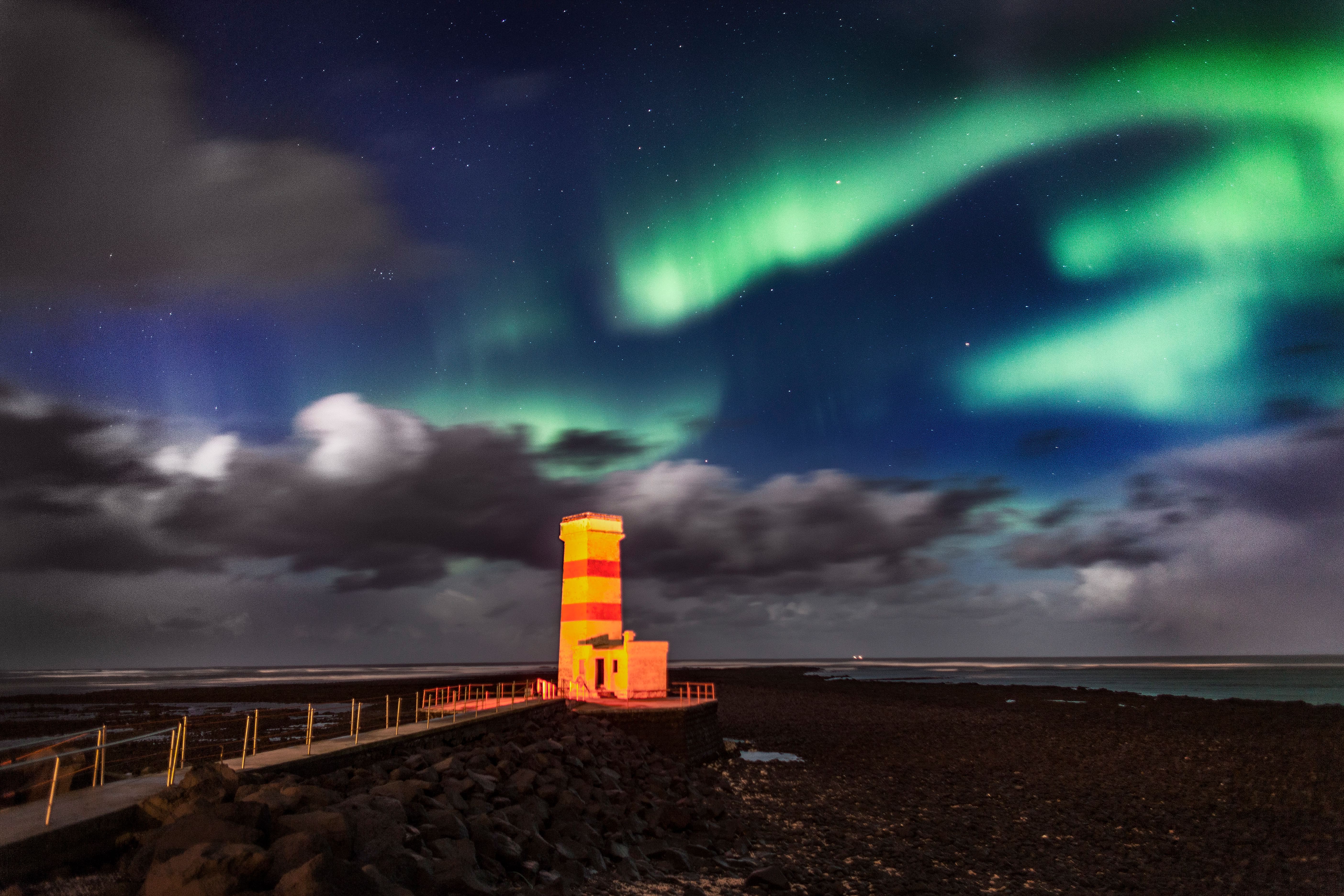 Northern Lights over a lighthouse in Reykjavik