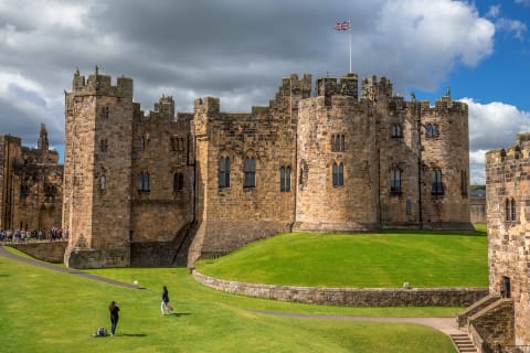Cover image for the Alnwick Castle Tour and the Borders including admission to Alnwick Castle and Bamburgh Castle from Edinburgh experience