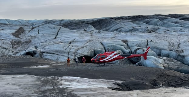 Cover image for the Combine the thrill of flying with the wonder of exploring a natural ice cave. experience