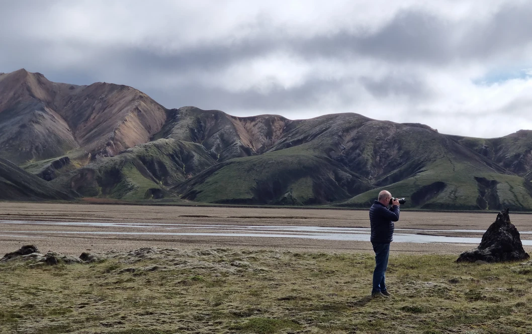 A man taking pictures of Landmannalaugar