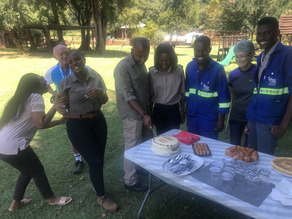 The team celebrating the birthday of the reserve