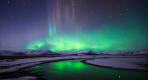 Thumbnail about The spectacular show of the Northern Lights over a snow-covered Icelandic landscape