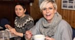 Thumbnail about A guest smiling while enjoying a cup of Icelandic soup