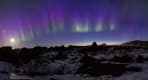 Thumbnail about Northern Lights over cliff in Iceland