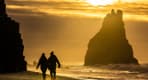 Thumbnail about Black Sand Beach with people holding hands and walking