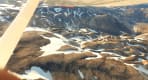 Thumbnail about Landmannalaugar mountains from above covered with a bit of snow