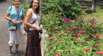 Thumbnail about Posing near the flower bed