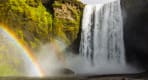 Thumbnail about Skógarfoss waterfall decorated with magical rainbow