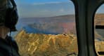 Thumbnail about Passenger looking out the window at a large crater