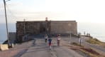 Thumbnail about Nazaré fort with lighthouse on cliff edge facing the Atlantic Ocean at sunset