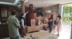 Thumbnail about Guide explaining traditional wine press to visitors inside a winery in Arouca Portugal.