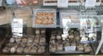 Thumbnail about Display of traditional Portuguese sweets including castanhas doces and melindres in a pastry shop in Arouca.