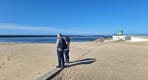 Thumbnail about Praia da Barra beach with Atlantic ocean, sandy shore, green beacon, and visitors
