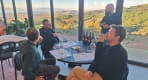 Thumbnail about Martha’s Port wine guided tasting with guests, wine shelves, bottles, glasses, and host explaining the selection