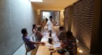 Thumbnail about Private wine tasting room at Quinta do Vallado with guests, guide, glasses, long table, and bottle wall