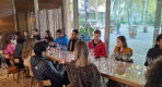 Thumbnail about Group wine tasting at Quinta da Pacheca with guests seated around glasses beside large windows