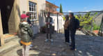 Thumbnail about Quinta do Seixo courtyard visit with guide and guests outside stone winery building overlooking Douro vineyards