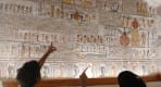 Thumbnail about Visitors exploring the colorful reliefs at Rameses II tomb  