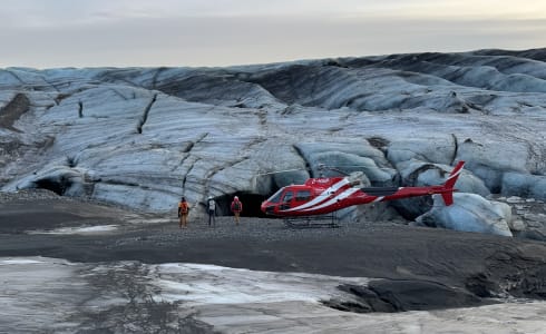 Cover image for the Combine the thrill of flying with the wonder of exploring a natural ice cave. experience