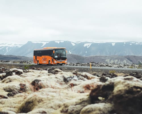 bus driving through lava field