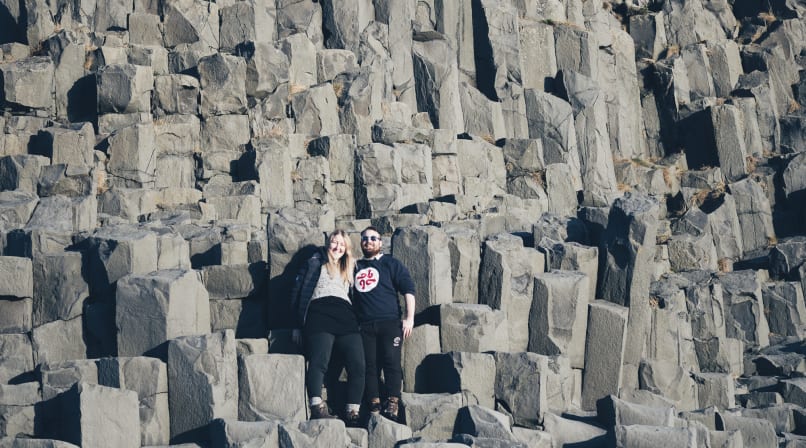 Becoming one with nature on top of basalt columns in Reynisfjara beach Iceland
