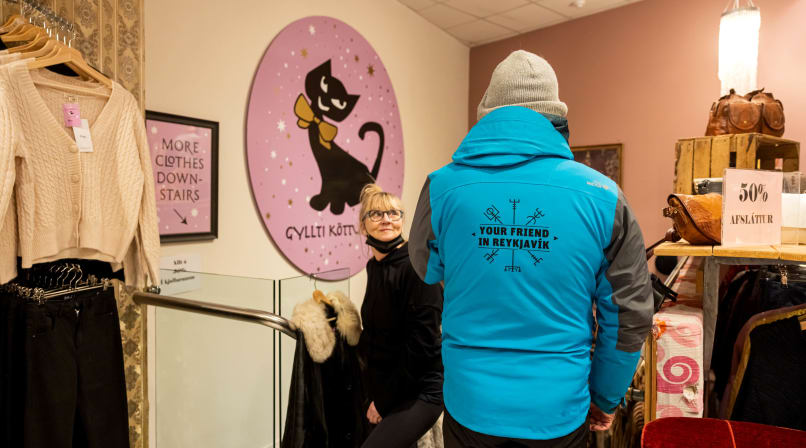A guide from Your Friend in Reykjavik conversing with a staff member of the store displayed. 
