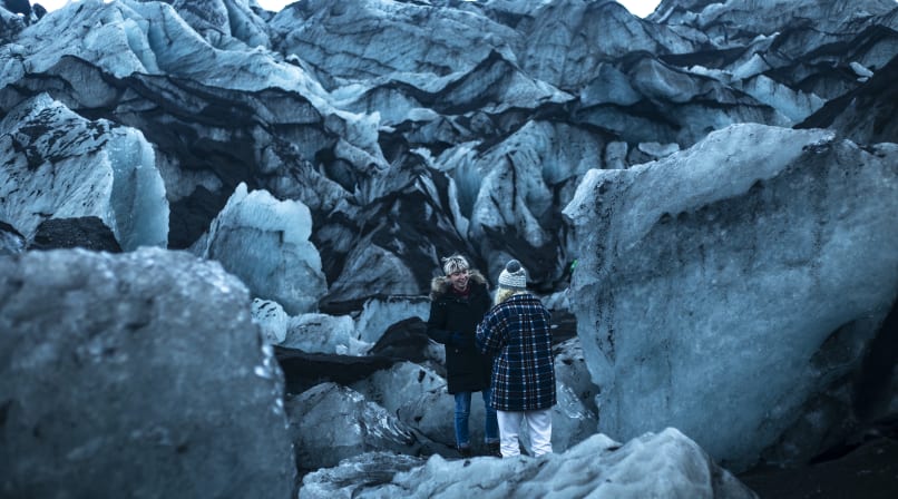 Having a laugh amongst the elements at Seljalandsfoss waterfall Iceland