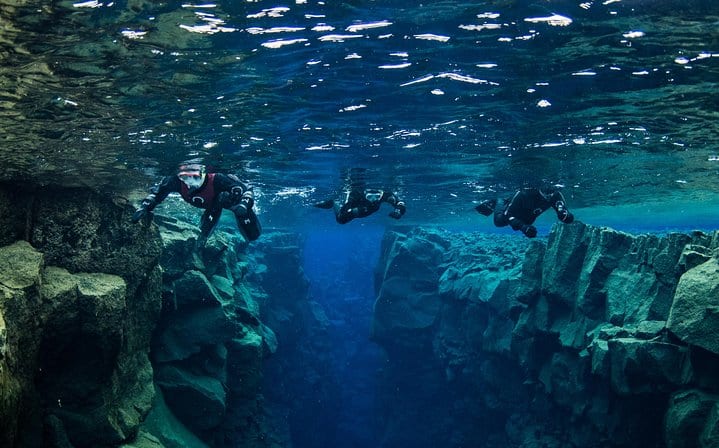 Snorkelers on top of Silfra fissure