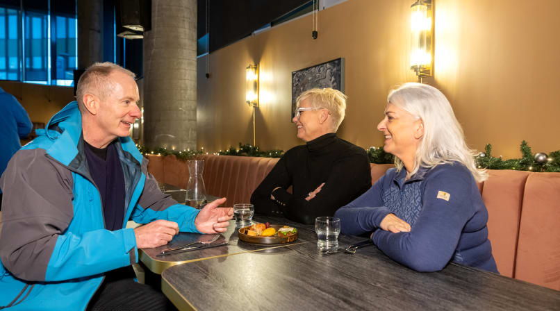 A group of guests enjoying a plate of appetizer