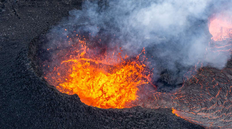 Volcanic crater bubbling with lava