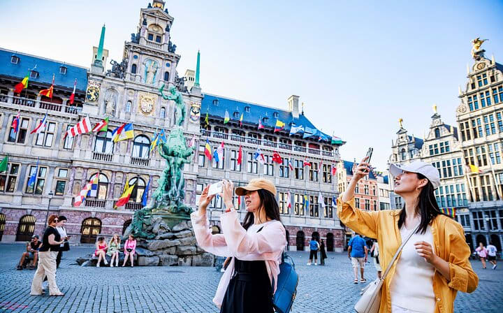 Our tourists taking pictures of the main Square of Antwerp