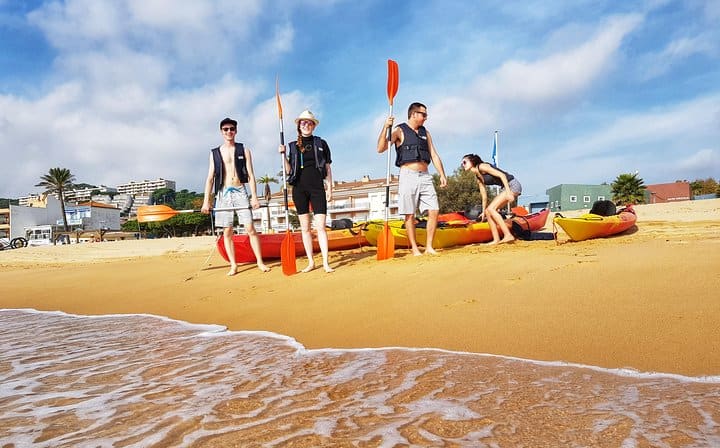 Getting ready for the sea kayaking experience on the beach in the Costa Brava.