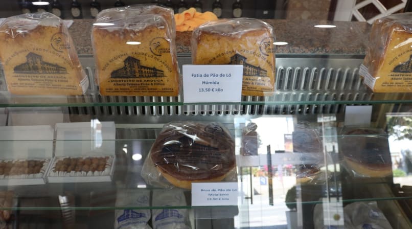 Packaged slices of traditional Pão de Ló cake displayed in a local bakery in Arouca.