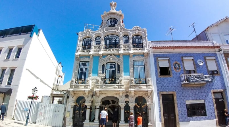 Art Nouveau Museum facade in Aveiro with ornate windows, tiles, and pedestrians