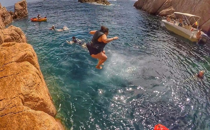 Enjoy dives from cliffs in a secluded bay.