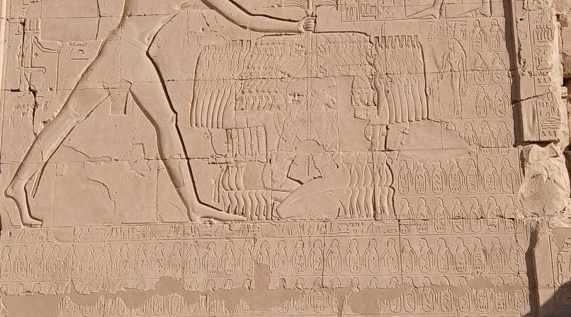 Pharaoh offering scene carved into the walls of Karnak temple
